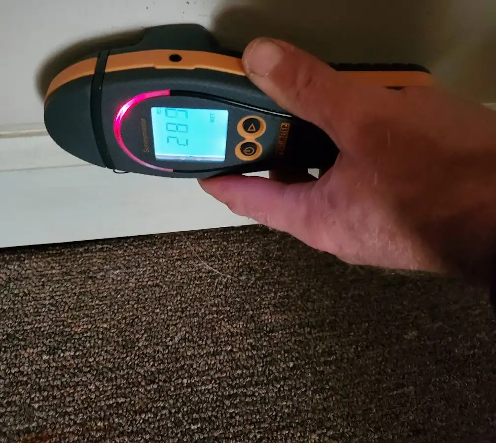 Moisture detection at baseboard during Burst Pipe Cleanup in Reminderville